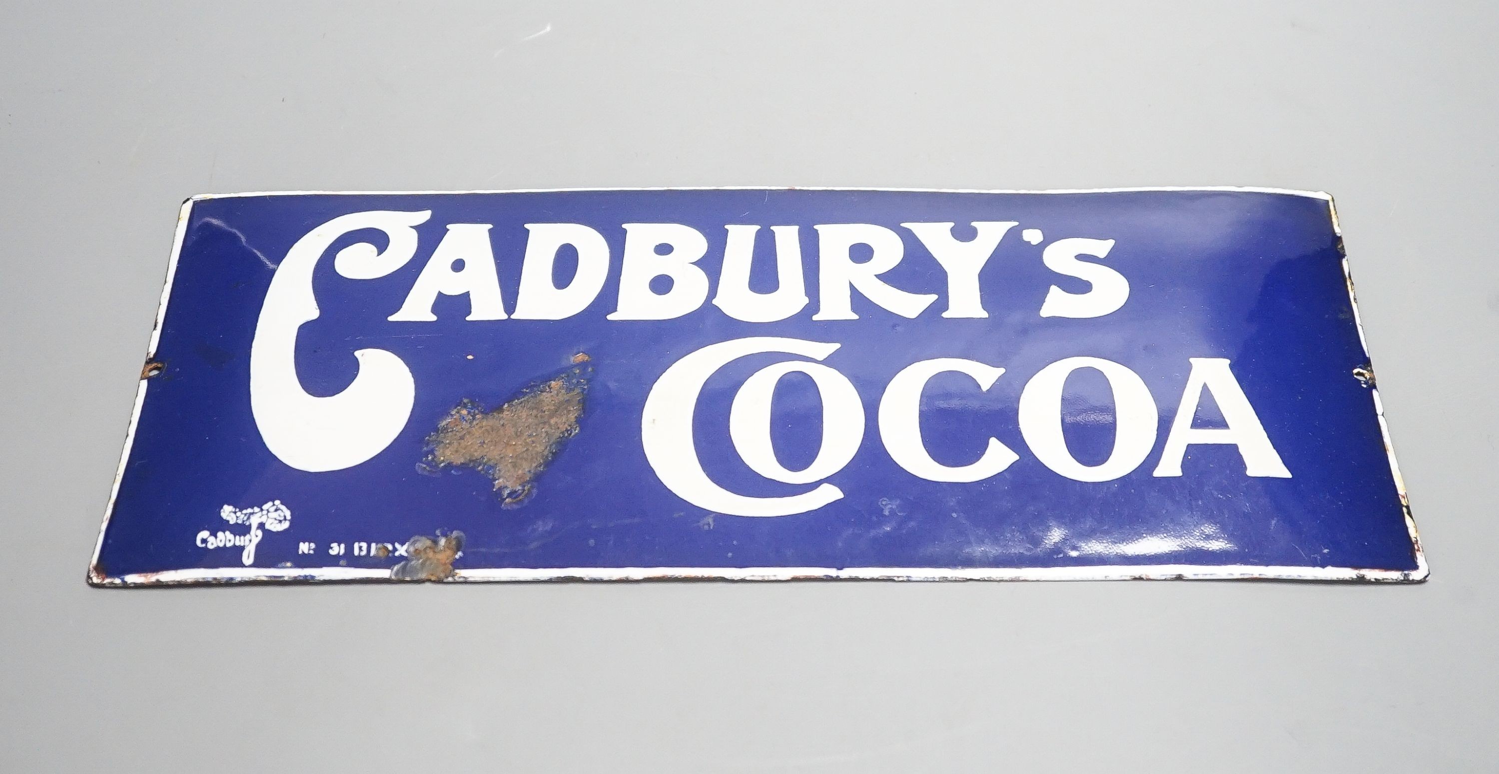 A Cadburys cocoa advertising enamel sign 15x35cm